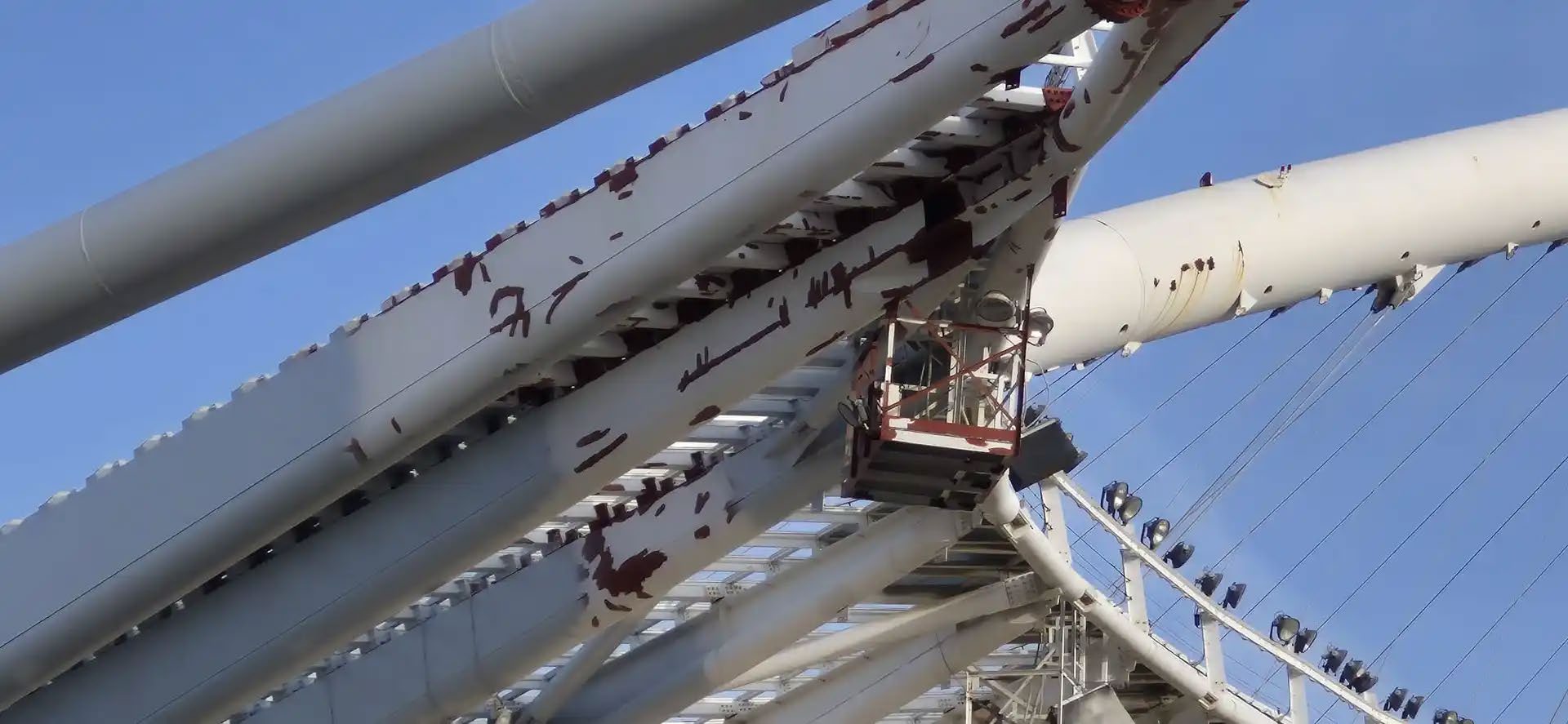 English red spot primer applied to rusted welds and seams on the Athens Olympic Stadium arches