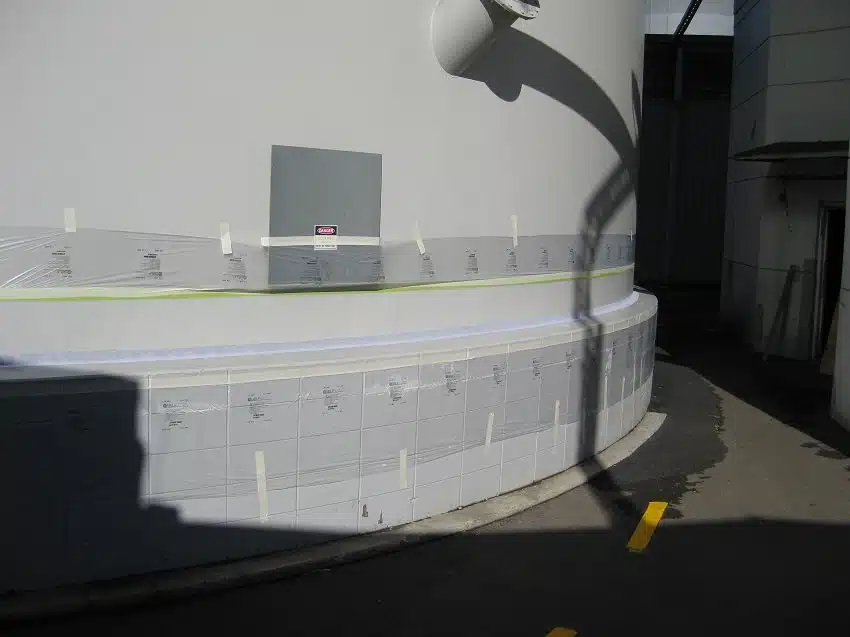 Silo base masked and coated with a seamless white Noxyde waterproof membrane